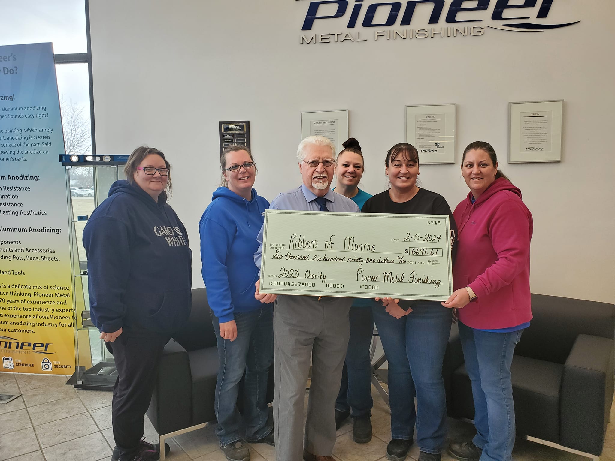 Logo of Pioneer Metal Finishing. A valued community partner supporting the Ribbons of Monroe cancer mission.